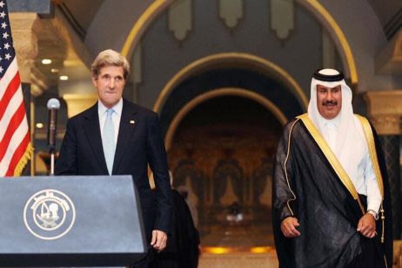 The US secretary of state, John Kerry, holds a press conference with Sheikh Hamad bin Jassim bin Jabr Al Thani, Qatar's foreign minister and prime minister, on Tuesday in Doha. Reuters
