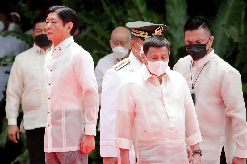 Philippine president Ferdinand Marcos Jr, left, and outgoing president Rodrigo Duterte, right, at the Malacanang Presidential Palace grounds in Manila in June 2022. AP Photo