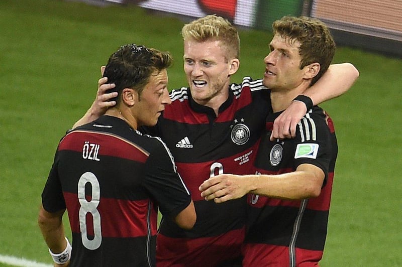 Mesut Ozil, Andre Schurrle and Thomas Muller celebrate one of Germany's goals in their 7-1 win over Brazil in the 2014 World Cup semi-finals. They play Argentina in the final on Sunday. Odd Andersen / AFP / July 8, 2014