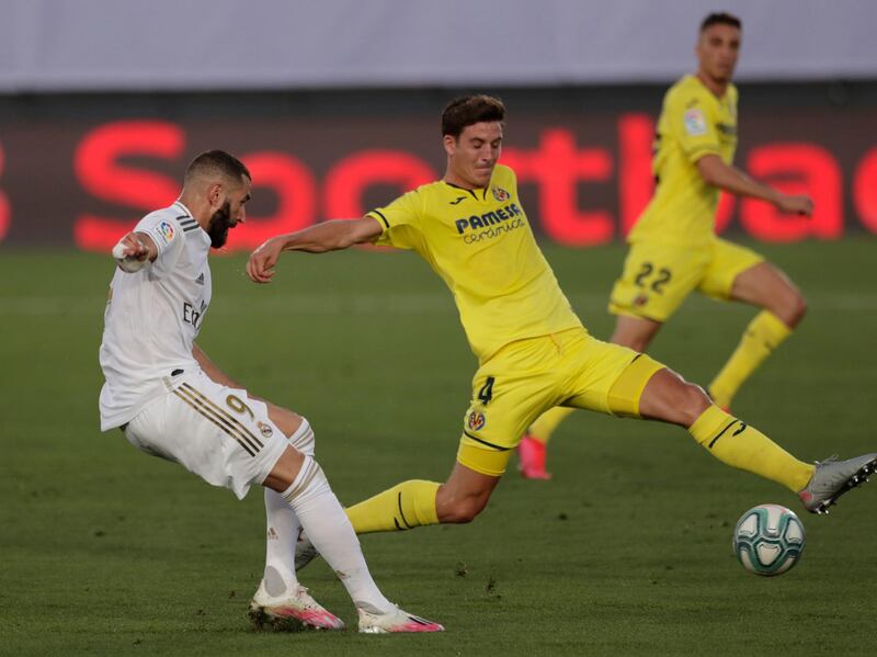 Real Madrid's Karim Benzema, left, shoots to score against Villarreal. AP