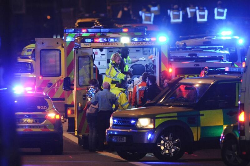 Members of the emergency services attend to victims of the terror attack on London Bridge. Daniel Sorabji / AFP