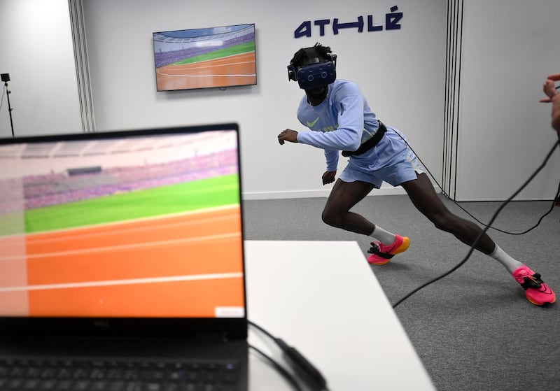 Ryan Zeze of the French 4x100 metre relay team trains with a virtual reality headset in Paris. AFP