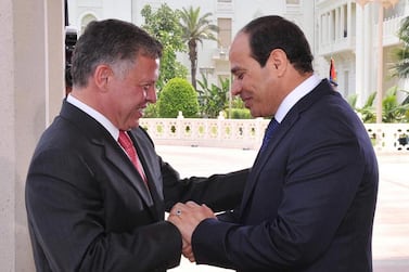 Handout picture from the Jordanian Royal Palace shows Jordan’s King Abdullah II, left, greeting Mr El Sisi, right, at the Presidential Palace in Cairo, Egypt on June 8, 2014 on the day of his inauguration. EPA