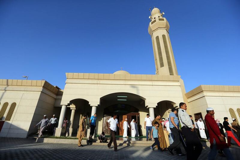 Worshipers gather at the Khalifia City Mosque for the Eid Al Adha prayers in Abu Dhabi. Sammy Dallal / The National