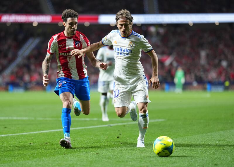 Luka Modric of Real Madrid battles with Sime Vrsaljko of Atletico Madrid. Getty Images