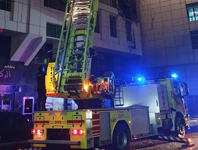 Firefighters tackle a blaze at a residential building in Al Nahyan area of Abu Dhabi. Courtesy: Abu Dhabi Police