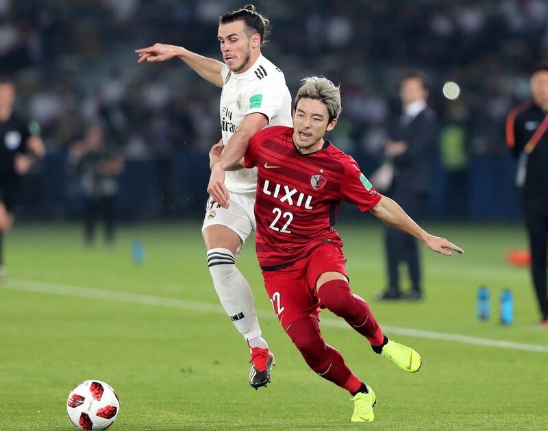 Abu Dhabi, United Arab Emirates - December 19, 2018: Gareth Bale of Real Madrid and Daigo Nishi of Antlers compete during the game between Real Madrid and Kashima Antlers in the Fifa Club World Cup semi final. Wednesday the 19th of December 2018 at the Zayed Sports City Stadium, Abu Dhabi. Chris Whiteoak / The National