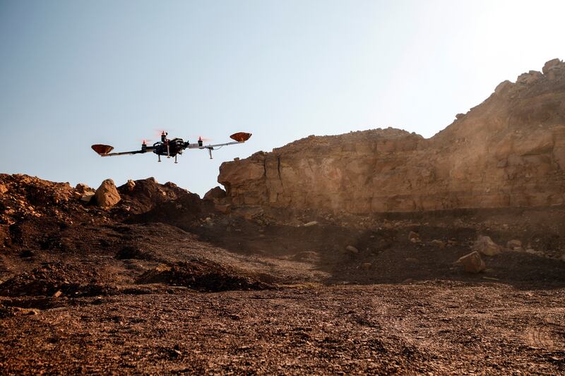 A drone hovers in the desert during an experiment. Reuters