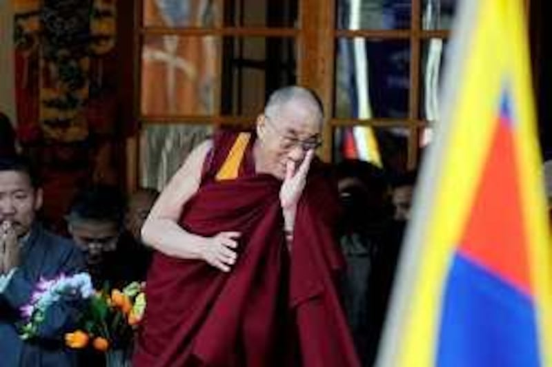 Tibetan spiritual leader His Holiness the Dalai Lama gestures after arriving to address a gathering at his palace temple in Dharamshala on March 10, 2009 to commemorate the 50th anniversary of Tibetan Uprising day.   Exiled Tibetan spiritual leader the Dalai Lama repeated his demand for "legitimate and meaningful autonomy" for Tibet and not independence from China."We Tibetans are looking for legitimate and meaningful autonomy, an arrangement that would enable Tibetans to live within the framework of the People's Republic of China," he said in a speech marking the 50th anniversary of a failed Tibetan uprising against Beijing. AFP PHOTO/ Manan VATSYAYANA *** Local Caption ***  Del269254.jpg