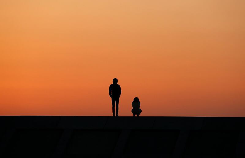A young couple offers a prayer for victims on a tsunami barrier at Arahama Beach in Sendaii, Miyagi Prefecture. Today is the seventh anniversary of the 9.0-magnitude earthquake and subsequent tsunami, that devastated northeastern Japan and triggered a nuclear disaster at Tokyo Electric Power Company's Fukushima Daiichi Nuclear Power Plant. The earthquake and tsunami killed 15,895 people and 2,539 are still missing. Kimimasa Mayama / EPA