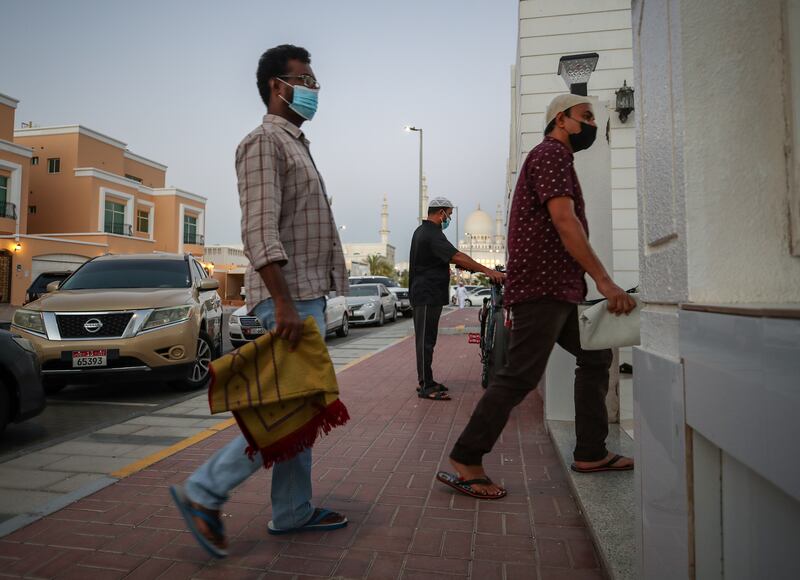 Worshippers arrive at the Ibn Taymiyyah Mosque in Abu Dhabi for evening prayers on the day the UAE learnt President Sheikh Khalifa had died. Victor Besa / The National.