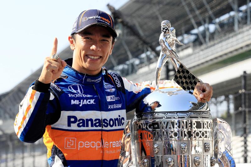 (FILES) In this file photo taken on August 23, 2020 Takuma Sato, driver of the #30 Panasonic / PeopleReady Rahal Letterman Lanigan Racing Honda, poses for a photo after winning the 104th running of the Indianapolis 500 at Indianapolis Motor Speedway in Indianapolis, Indiana.   Indianapolis 500 will allow up to 135,000 spectators, the largest US sports crowd since the Covid-19 pandemic, for the May 30 race, officials announced April 21, 2021. / AFP / GETTY IMAGES NORTH AMERICA / ANDY LYONS
