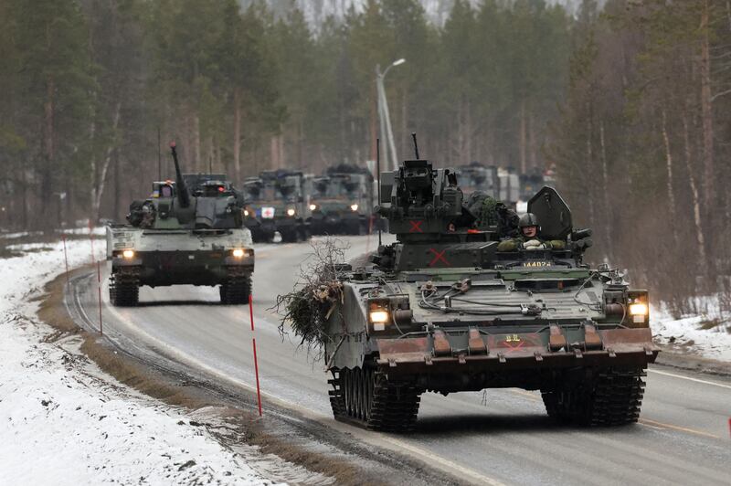 Swedish military vehicles during Nato and allied drills in the Arctic Circle. Reuters