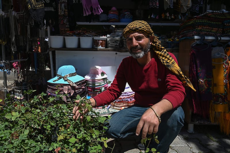 Aydin Cetintas, 45, sells black roses in the town of Halfeti. 