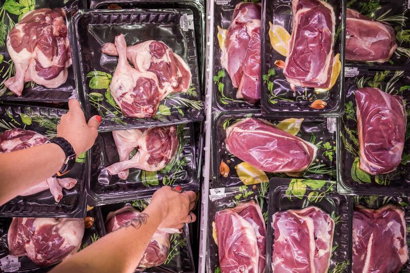 An employee arranges packages of fresh red meat cuts in the refrigerated aisle inside a Lidl Ltd. grocery store in Vecses, Hungary, on Monday, June 4, 2018. Hungary is enjoying an upturn and the $130 billion economy may expand 4.1 percent in 2019, Finance Minister Mihaly Varga said in a recent interview. Photographer: Akos Stiller/Bloomberg