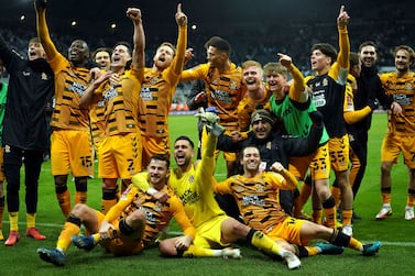 Cambridge United players celebrate victory after the final whistle of the English FA Cup third round soccer match between Newcastle United and Cambridge United at St.  James' Park, Newcastle upon Tyne, England, Saturday Jan.  8, 2022.  (Owen Humphreys / PA via AP)