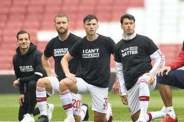 LONDON, ENGLAND - JUNE 10: Cedric Soares, Shkodran Mustafi, Kieran Tierney and Gabriel Martinelli of Arsenal take a knee in support of Black Lives Matter before the friendly match between Arsenal and Brentford at Emirates Stadium on June 10, 2020 in London, England. (Photo by David Price/Arsenal FC via Getty Images)