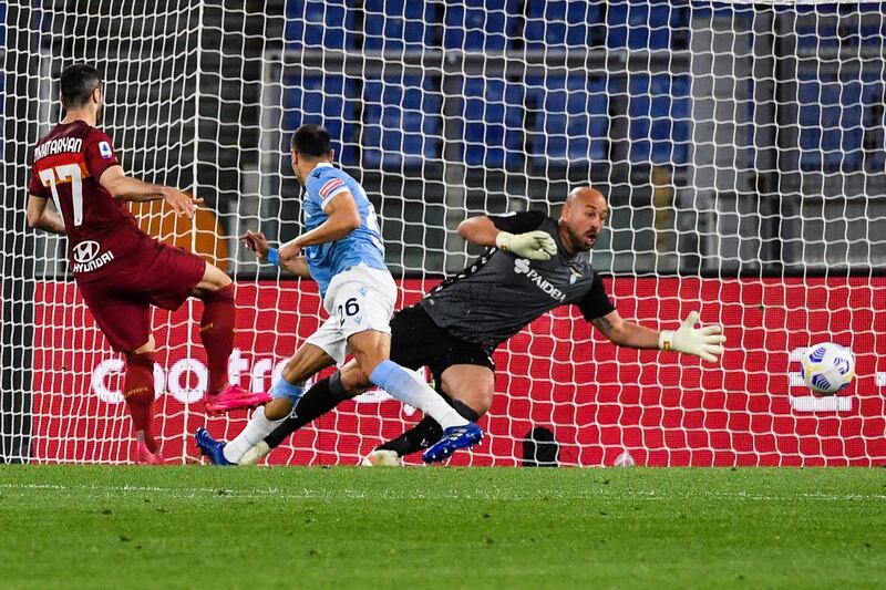 Roma's Armenian midfielder Henrikh Mkhitaryan shoots to open the scoring past Lazio's Spanish goalkeeper Pepe Reina. AFP