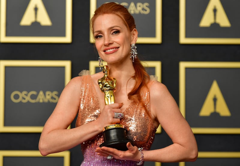 US actress Jessica Chastain poses with the award for Best Actress in a Leading Role for her performance in 'The Eyes of Tammy Faye' in the press room during the 94th Oscars at the Dolby Theatre in Hollywood, California. AFP