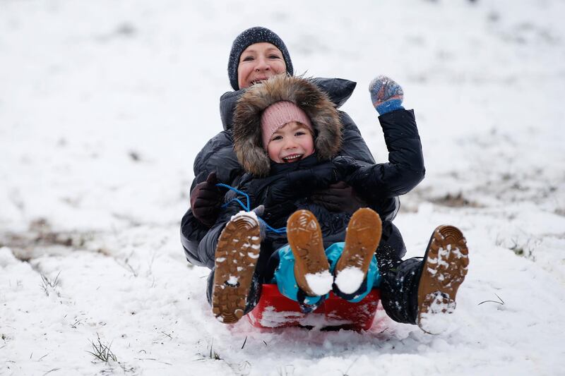 People go sledging in the snow on Parliament Hill on Hampstead Heath in London, United Kingdom. Parts of the country saw snow and icy conditions as arctic air caused temperatures to drop. Getty Images