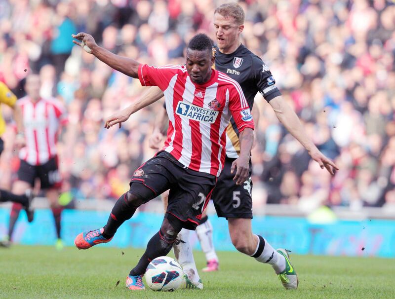 Sunderland's Beninese midfielder Stephane Sessegnon (front) is challenged by Fulham's Norwegian defender Brede Hangeland during the English Premier League football match between Sunderland and Fulham at Stadium of Light in Sunderland, northeast England, on March 2, 2013. The match ended 2-2. AFP PHOTO/LINDSEY PARNABY



RESTRICTED TO EDITORIAL USE. No use with unauthorized audio, video, data, fixture lists, club/league logos or "live" services. Online in-match use limited to 45 images, no video emulation. No use in betting, games or single club/league/player publications.

 *** Local Caption ***  605918-01-08.jpg
