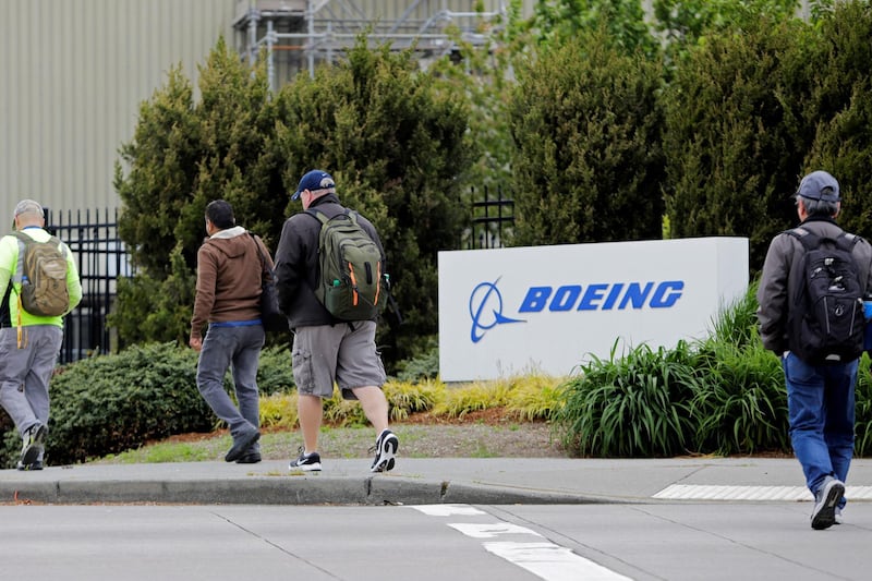 FILE PHOTO: Workers enter the Boeing Renton Factory in Renton, Washington, U.S. April 21, 2020.  REUTERS/Jason Redmond/File Photo