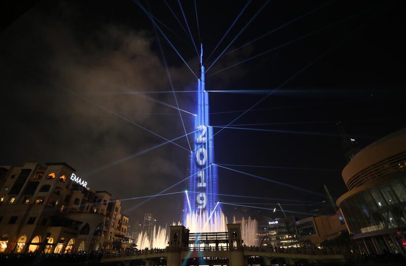 epa07255816 Fireworks illuminate the sky around Burj Khalifa, the tallest building in the world, during New Year's 2019 celebrations in the Gulf emirate of Dubai, United Arab Emirates, 01 January 2019.  EPA/ALI HAIDER
