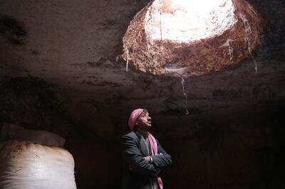 Mahmoud Abu Khalifa, 35, stands inside an ancient cave he uses to store his belongings and raise his sheep, at Babisqa. 