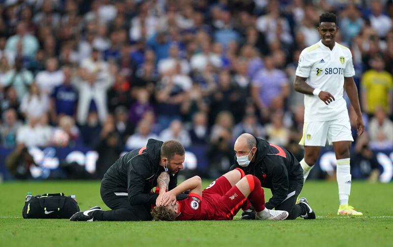 Liverpool's Harvey Elliott receives treatment after dislocating his ankle during the Premier League game against Leeds United at Elland Road on Sunday ,September 1. PA