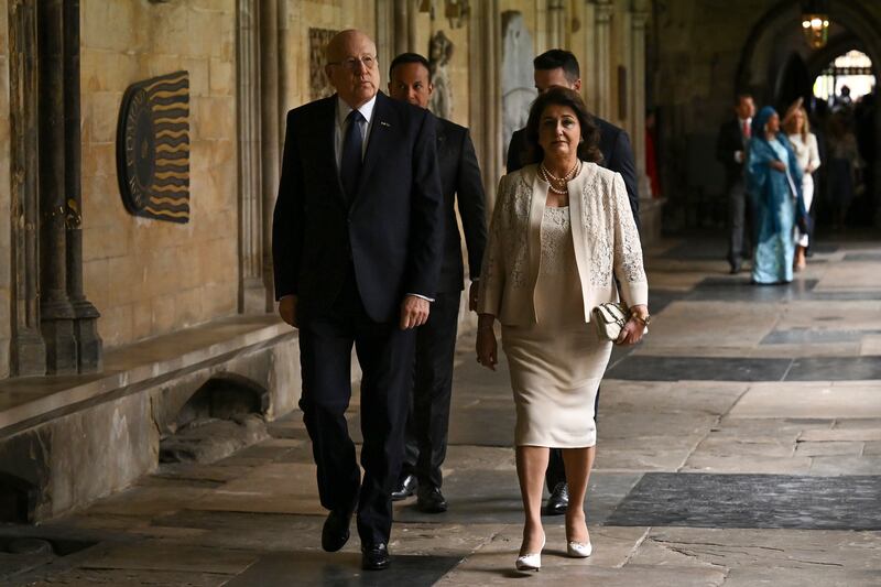 Lebanon's Prime Minister Najib Mikati, left, arrives. AP