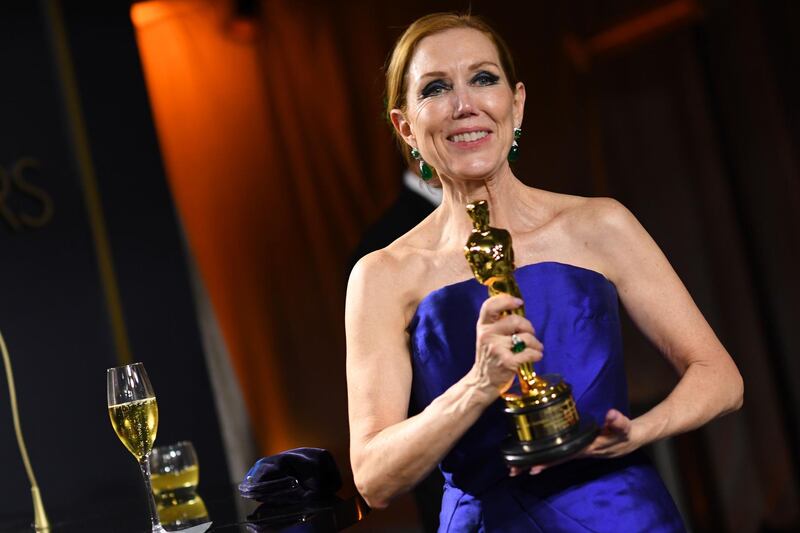US hair stylist Anne Morgan poses with the Oscar for Best Make-up and Hairstyling for "Bombshell" at the Governors Ball after the Oscars on Sunday, February 9, 2020, at the Dolby Theatre in Los Angeles. AFP