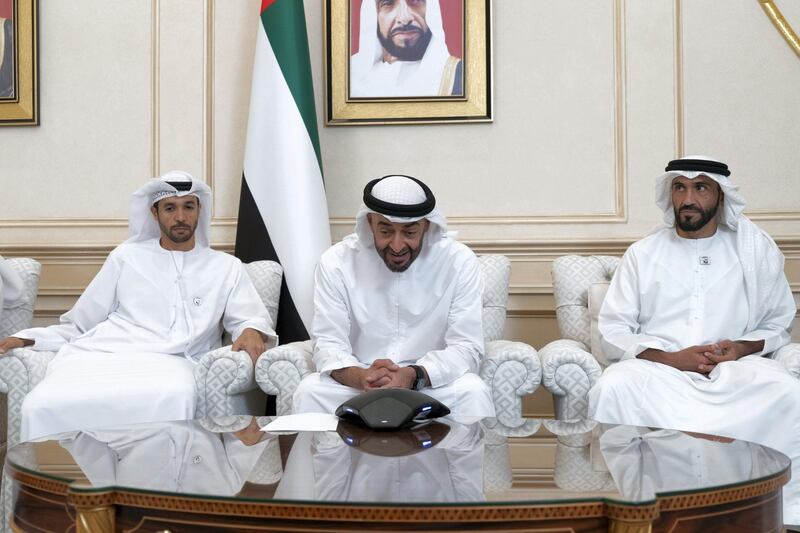 ABU DHABI, UNITED ARAB EMIRATES - September 23, 2019: HH Sheikh Mohamed bin Zayed Al Nahyan, Crown Prince of Abu Dhabi and Deputy Supreme Commander of the UAE Armed Forces (C), speaks over the phone to Astronaut Major Hazza Al Mansouri who will launch into space on September 25th and Dr Sultan Al Neyadi, a member of the mission’s back-up crew, at the Sea Palace. Seen with HH Sheikh Nahyan Bin Zayed Al Nahyan, Chairman of the Board of Trustees of Zayed bin Sultan Al Nahyan Charitable and Humanitarian Foundation (R).

( Rashed Al Mansoori / Ministry of Presidential Affairs )
---