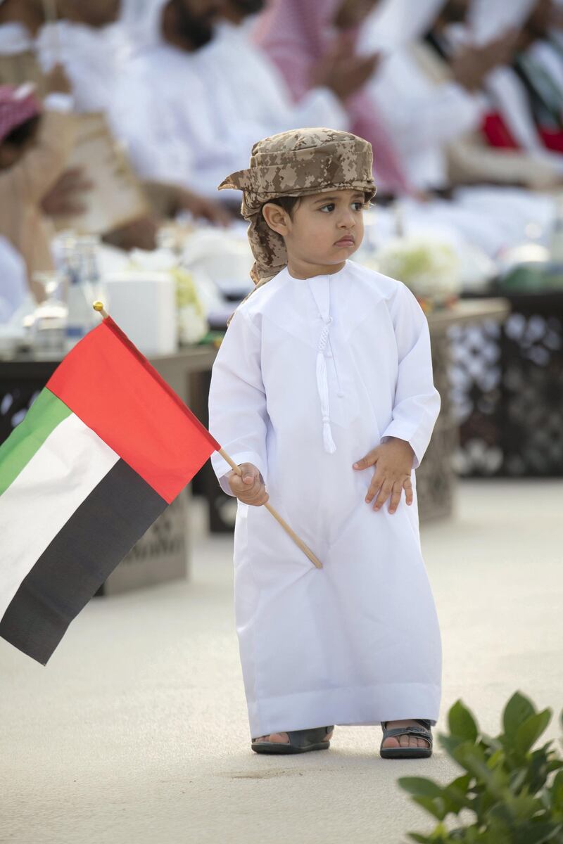 AL WATHBA, ABU DHABI, UNITED ARAB EMIRATES - December 03, 2017:  A young guest attends the opening of the Sheikh Zayed Heritage Festival. 

( Mohamed Al Suwaidi for the Crown Prince Court - Abu Dhabi )
---