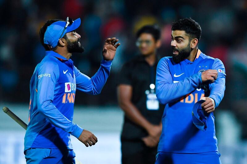 India's captain Virat Kohli (R) speaks with teammate Ravindra Jadeja after defeating Australia during the second one day international (ODI) cricket match of a three-match series between India and Australia at Saurashtra Cricket Association Stadium in Rajkot on January 17, 2020. IMAGE RESTRICTED TO EDITORIAL USE - STRICTLY NO COMMERCIAL USE
 / AFP / Jewel SAMAD / IMAGE RESTRICTED TO EDITORIAL USE - STRICTLY NO COMMERCIAL USE
