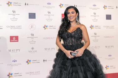 Huda Kattan arrives at the Global Gift Gala red carpet in December 2018. The beauty mogul has been awarded a star on the Dubai Stars walk of fame. Reem Mohammed / The National