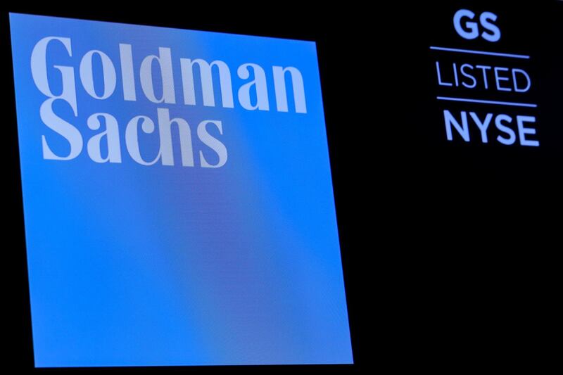 FILE PHOTO: The ticker symbol and logo for Goldman Sachs is displayed on a screen on the floor at the New York Stock Exchange (NYSE) in New York, U.S., December 18, 2018. REUTERS/Brendan McDermid/File Photo
