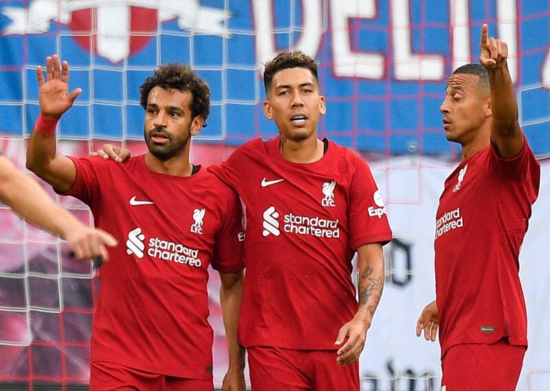  Liverpool's Mohamed Salah celebrates scoring their first goal with Roberto Firmino and Thiago Alcantara. Reuters