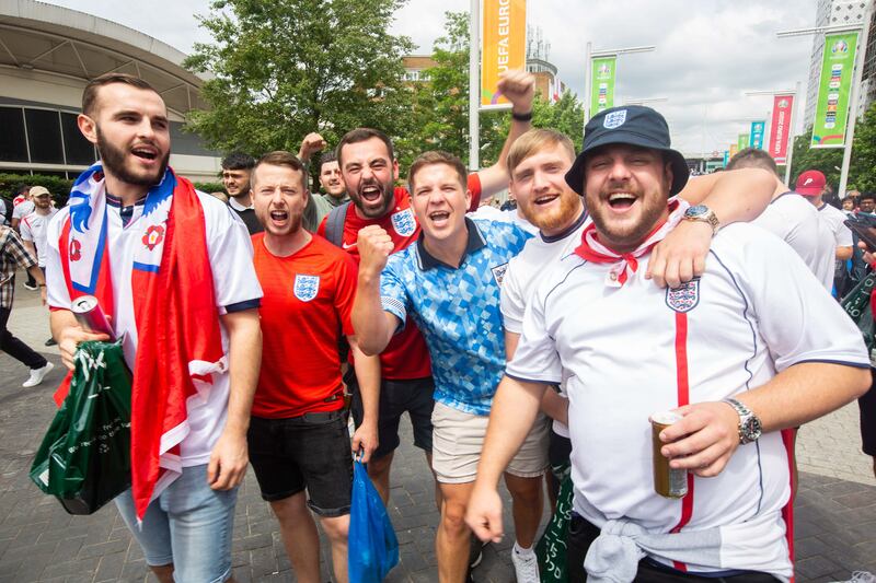 Fans arrive at Wembley stadium ahead of the Euros football final between England and Italy.