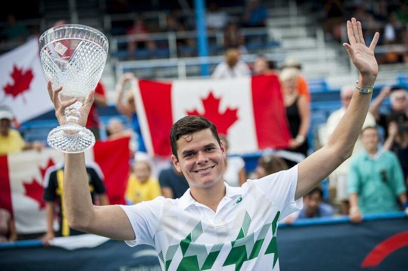 Milos Raonic of Canada celebrates with the trophy after defeating Vasek Pospisil of Canada during their final singles match at the Citi Open tennis tournament in Washington, DC, USA on August 3, 2014. EPA/PETE MAROVICH