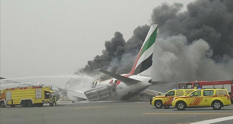 The aftermath of the crash landing of Emirates flight EK521 at Dubai Airport. 

