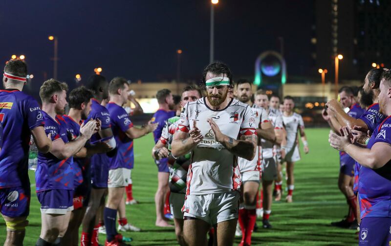 Abu Dhabi Harlequins celebrate the win over the Jebel Ali Dragons. Khushnum Bhandari/ The National