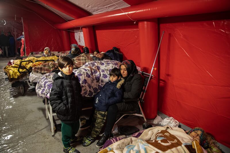 Injured survivors wait to be treated at a field hospital in Iskenderun,Turkey. Getty