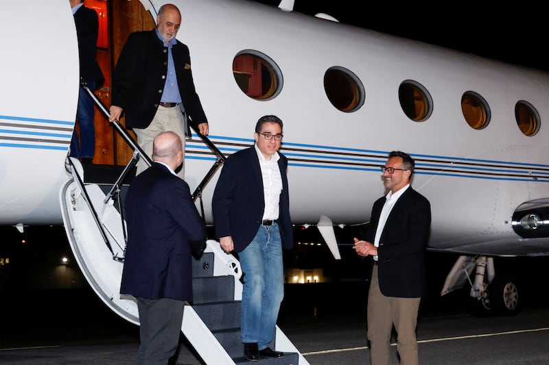 US Special Presidential Envoy for Hostage Affairs Roger Carstens greets freed Americans Siamak Namazi, Morad Tahbaz and Emad Shargi who were released in a prisoner swap deal with Iran, at Fort Belvoir, Virginia. Reuters