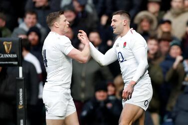 England's Jonny May celebrates scoring their third try to complete his hat-trick with Chris Ashton Action. Reuters