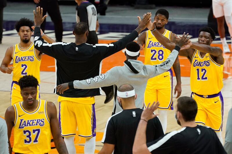 The Los Angeles Lakers celebrate against the Phoenix Suns. AP
