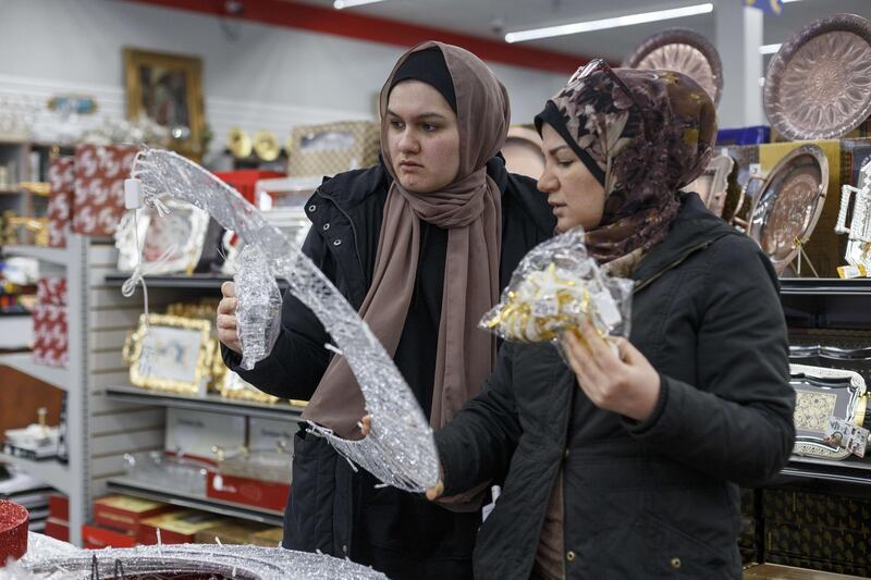 Zeinab Assi (L) stands next to her mother, Kay Dourra, while shopping for Ramadan decorations at Heights Kitchenware on the first day of Ramadan on April 23, 2020 in Dearborn Heights, Michigan. Getty Images via AFP