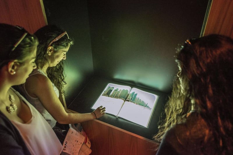 Visitors go through one of the interactive displays at the UAE pavilion. Giuseppe Aresu / The National