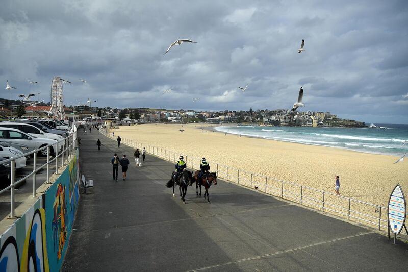 Mounted police patrol Bondi Beach in Sydney. More than five million people in the Australian city and surrounding areas entered a 14-day lockdown on Saturday, June 26. EPA