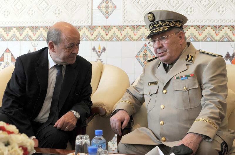 French Defence Minister Jean-Yves Le Le Drian speaks with Gen Gaid Salah in 2014. AFP