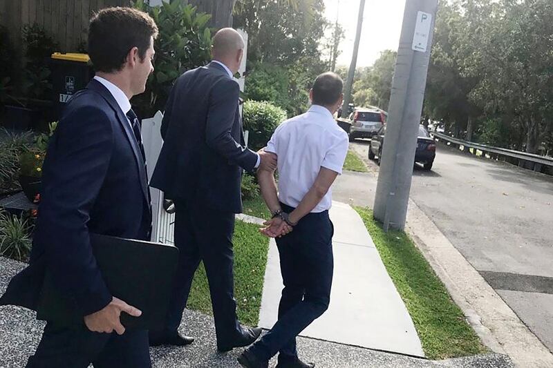 Officers arrested Russell Waugh from his Brisbane home on Wednesday before he was charged with foreign bribery. Photo provided by the Australian Federal Police